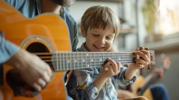 Children smiling during a group music lesson at Arrow Music Center